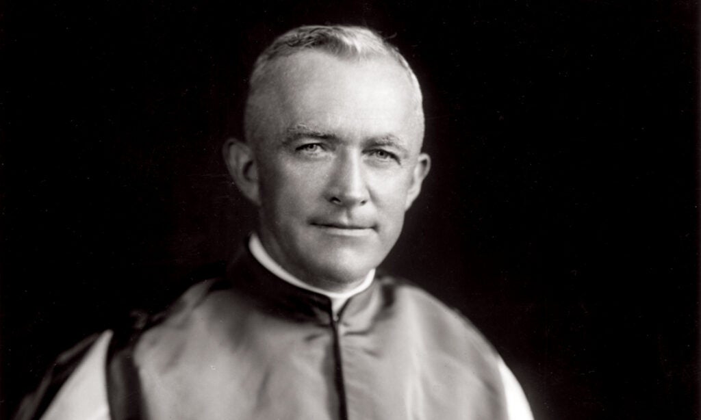 Msgr. John O'Grady, the first executive secretary of Catholic Charities. He wears priestly garb of the 1920s.